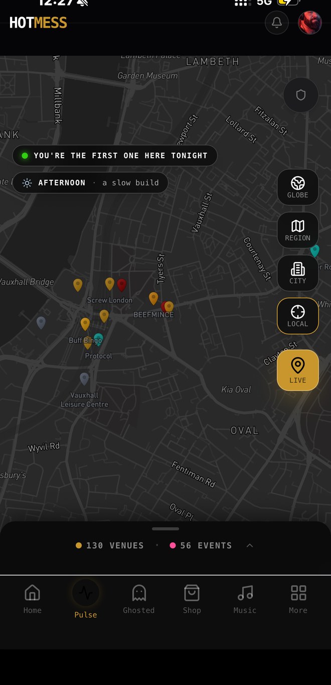 HOTMESS live globe — venues lit as gold pins across the city